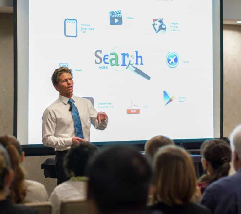 Tyler Collins speaking at rehab marketing agency seminar on the topic of SEO